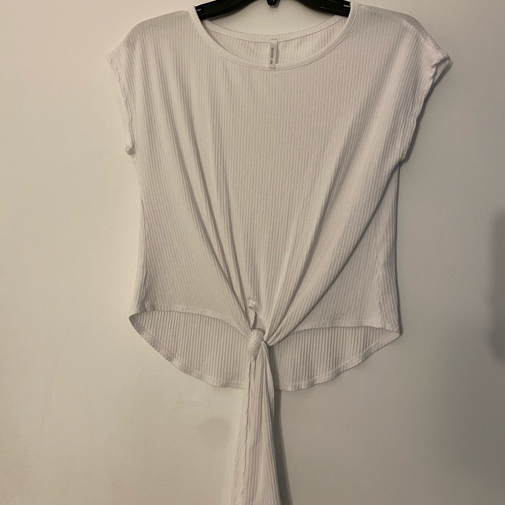 White tee with tie knot at the bottom